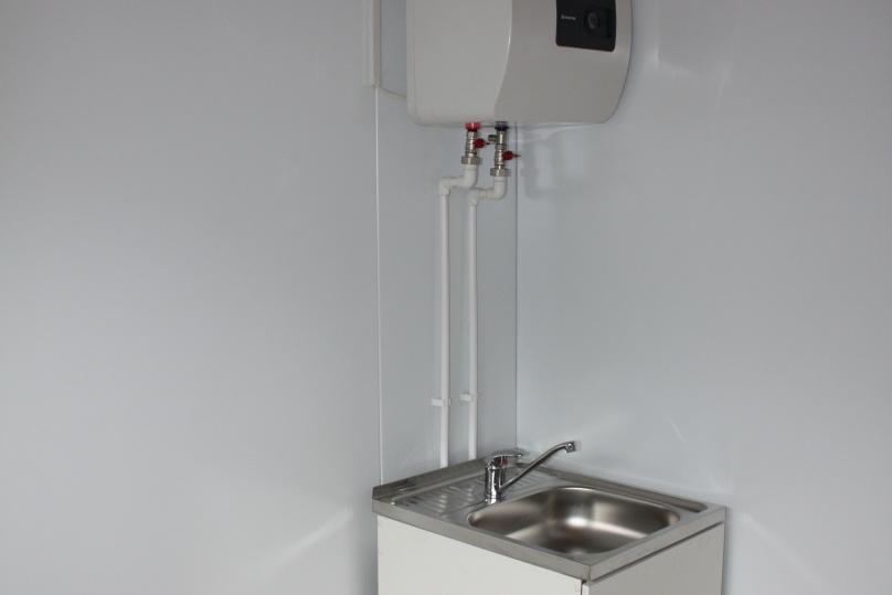 A sink with a heater in the domestic room