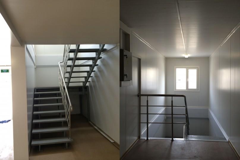 The staircase is finished with wood and equiped with the stainless steel handrail
