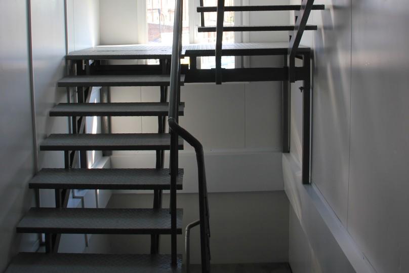 Internal stairs with railings made ​​of stainless steel