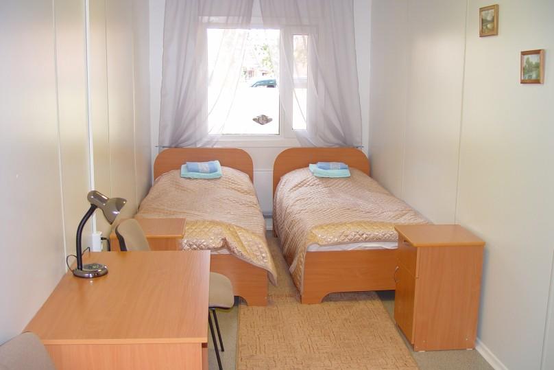 Dorm room with single beds