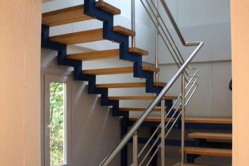 Фото Staircase with wooden steps and stainless steel handrails