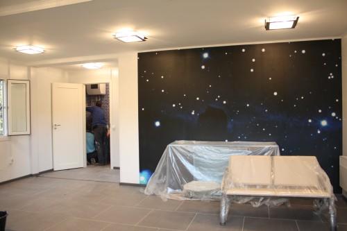 Фото Decorating the walls with photo wallpapers and the tiles floor finishing