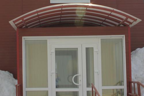 Фото Large canopy made of rolled tubes and polycarbonate